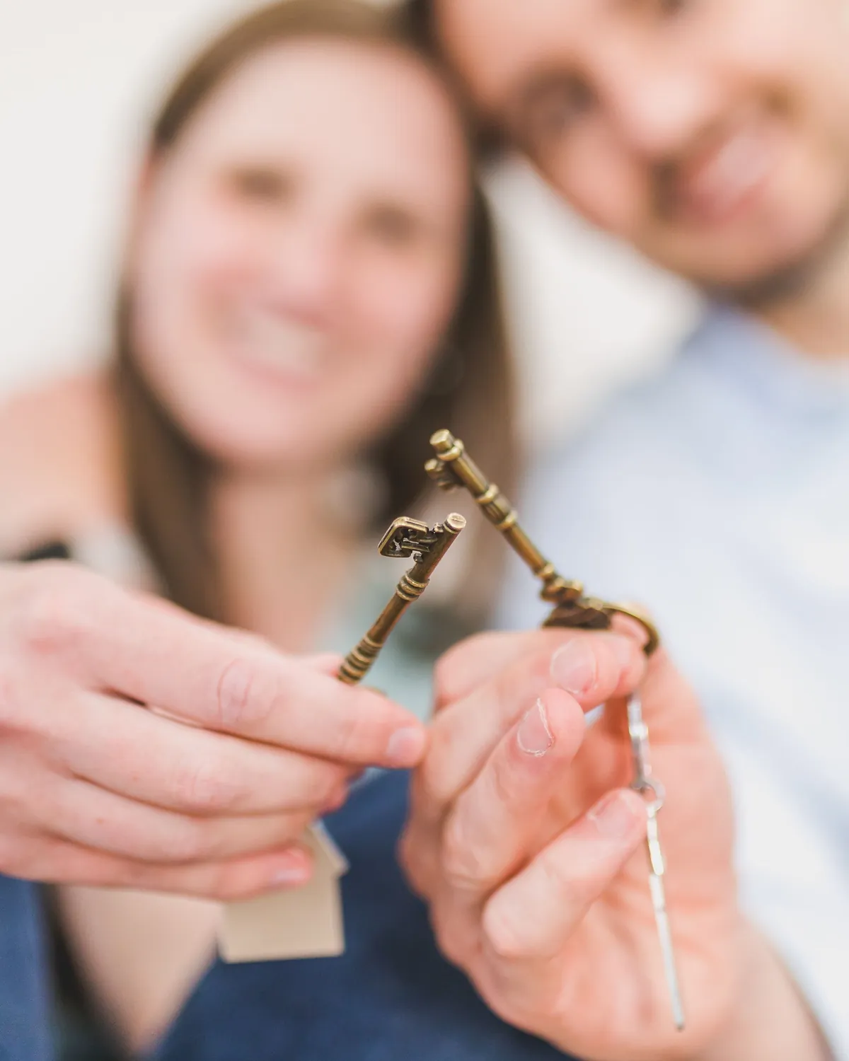 A set of house keys being handed over